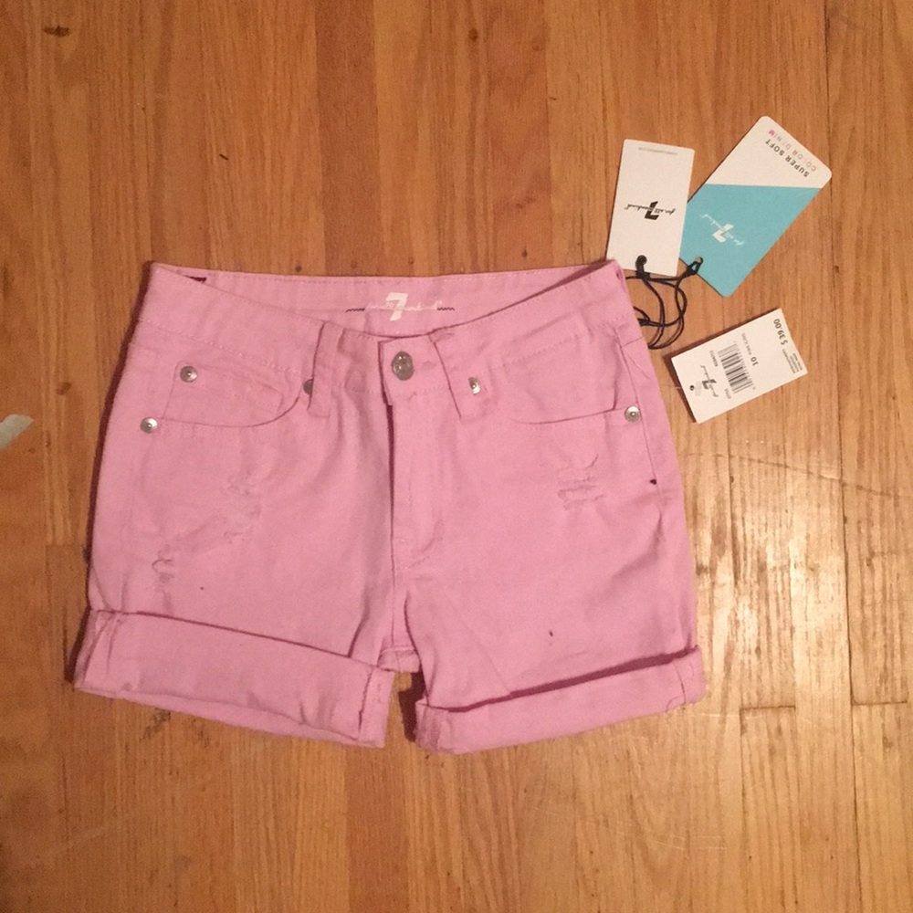 Pink distressed shorts